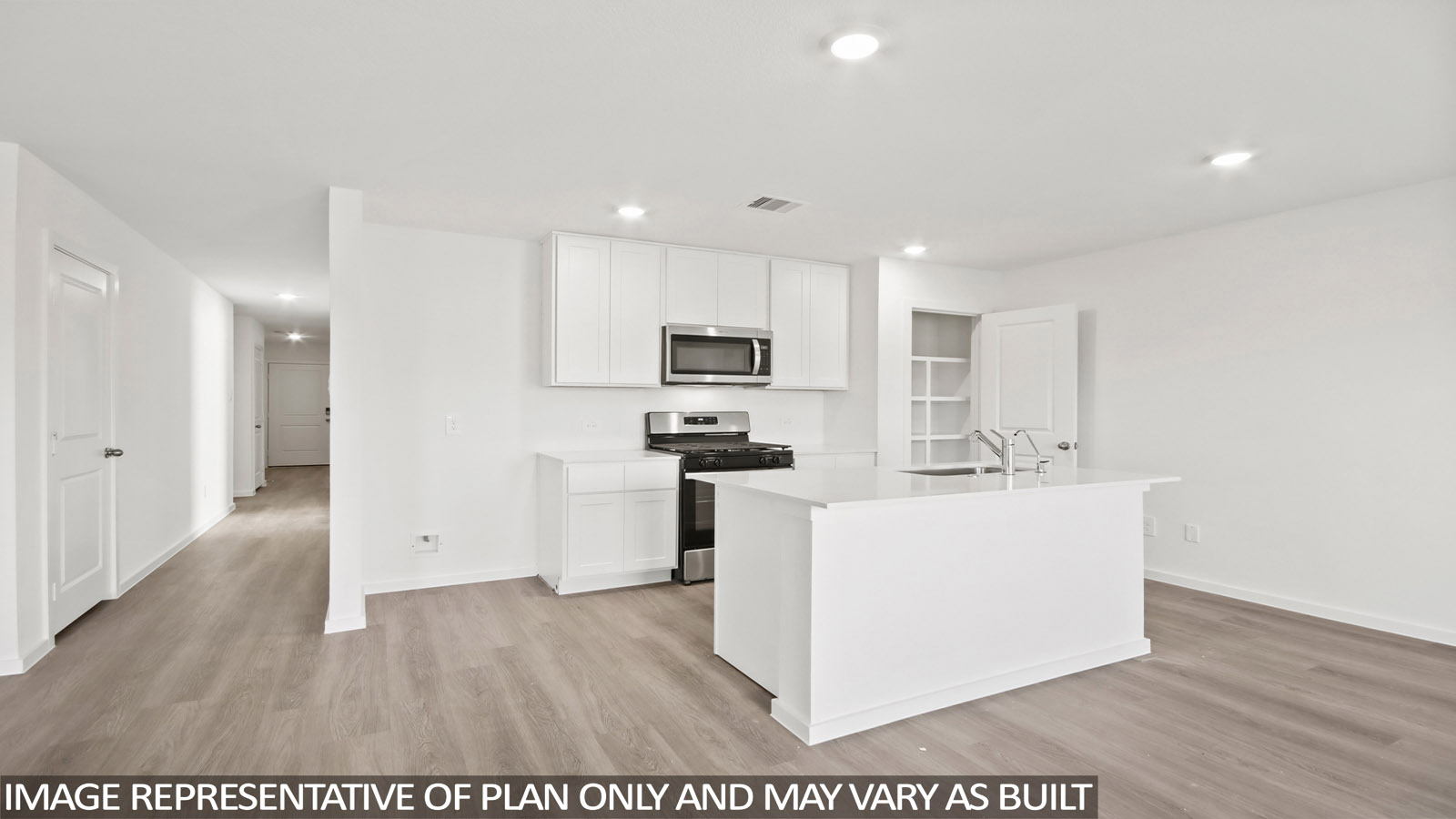 Kitchen with quartz countertops and marden hardware and an island and vinyl floor