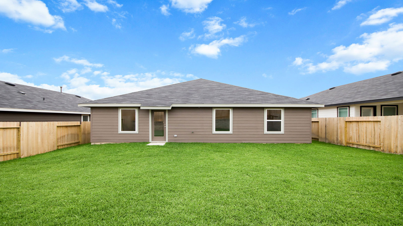 One story home with two car garage with brick and siding in Magnolia TX