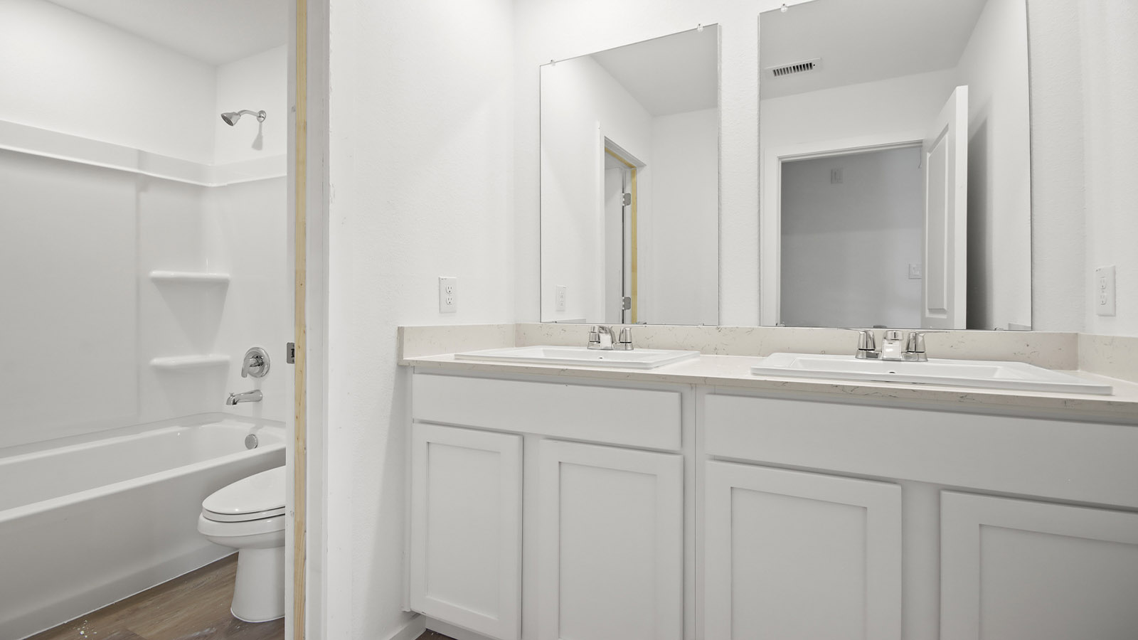 Secondary bathroom with tub/shower combo with quartz counter tops in Magnolia TX