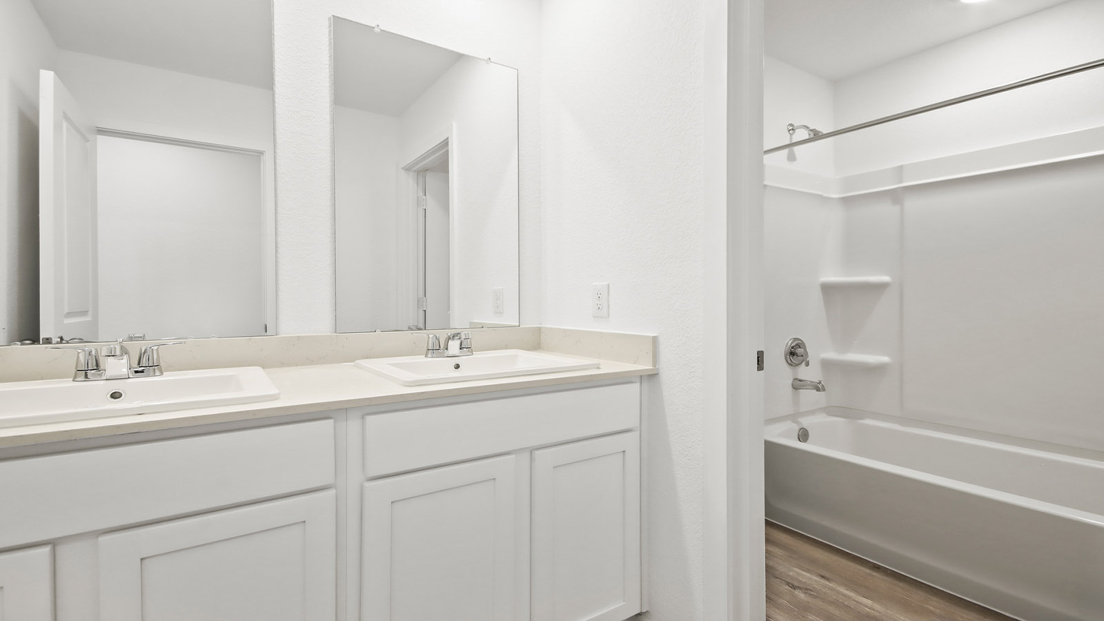 Secondary bathroom with double sinks quartz counter tops in Magnolia TX