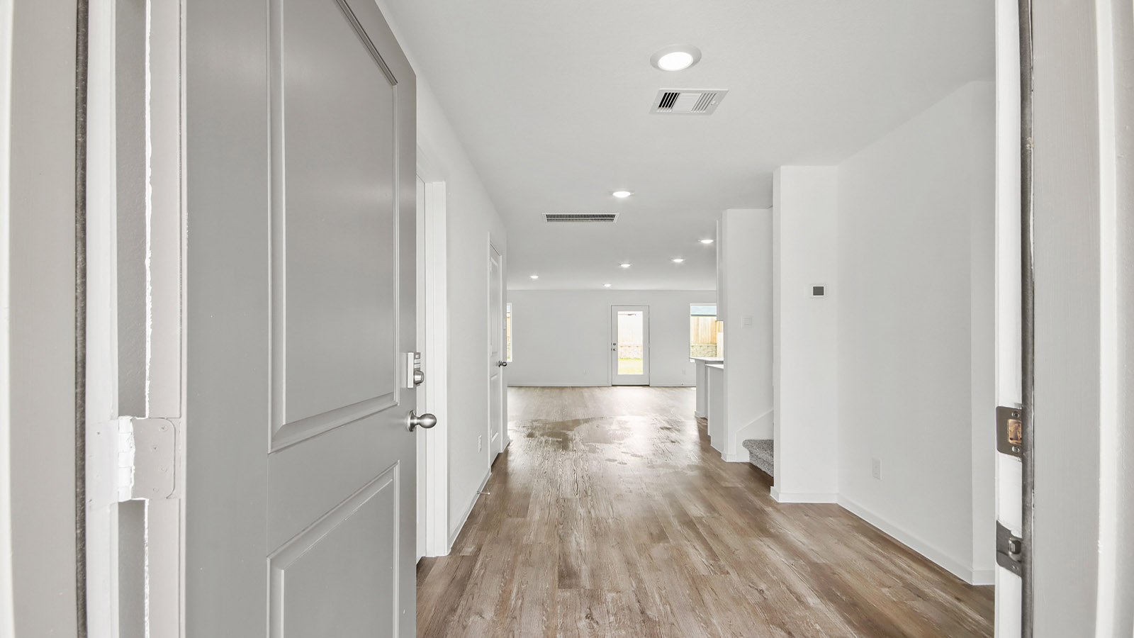 Entry hallway with vinyl flooring sherman williams painted walls