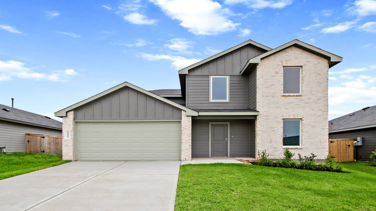 two story house with 2 car garage