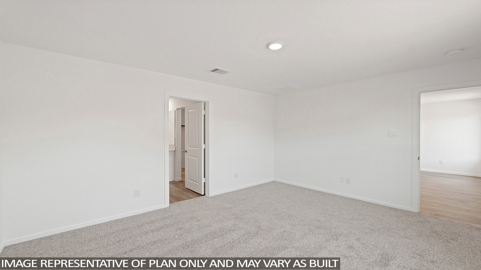 Secondary bedroom with windows, white walls, and light carpet.