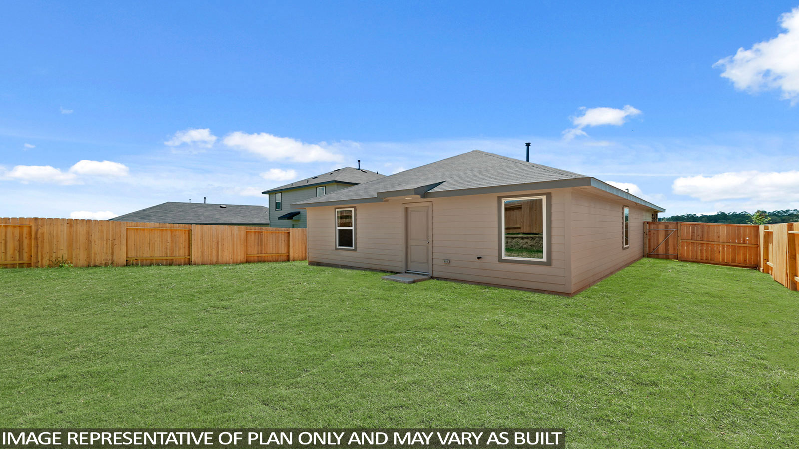 Landscaped backyard with a covered patio.