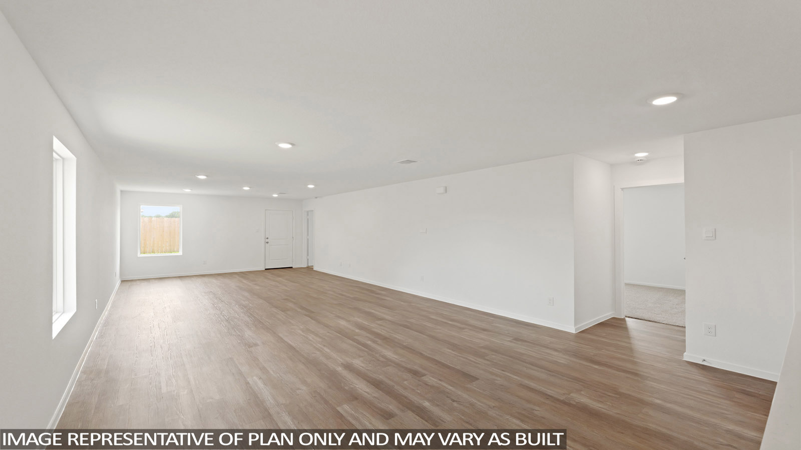 Open living room with windows, white walls, and vinyl wood flooring.