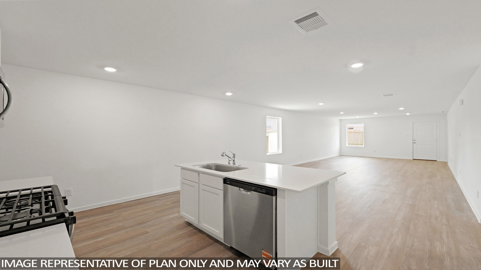 Open kitchen with an island, stainless steel appliances, white cabinets, white walls, and vinyl wood flooring.