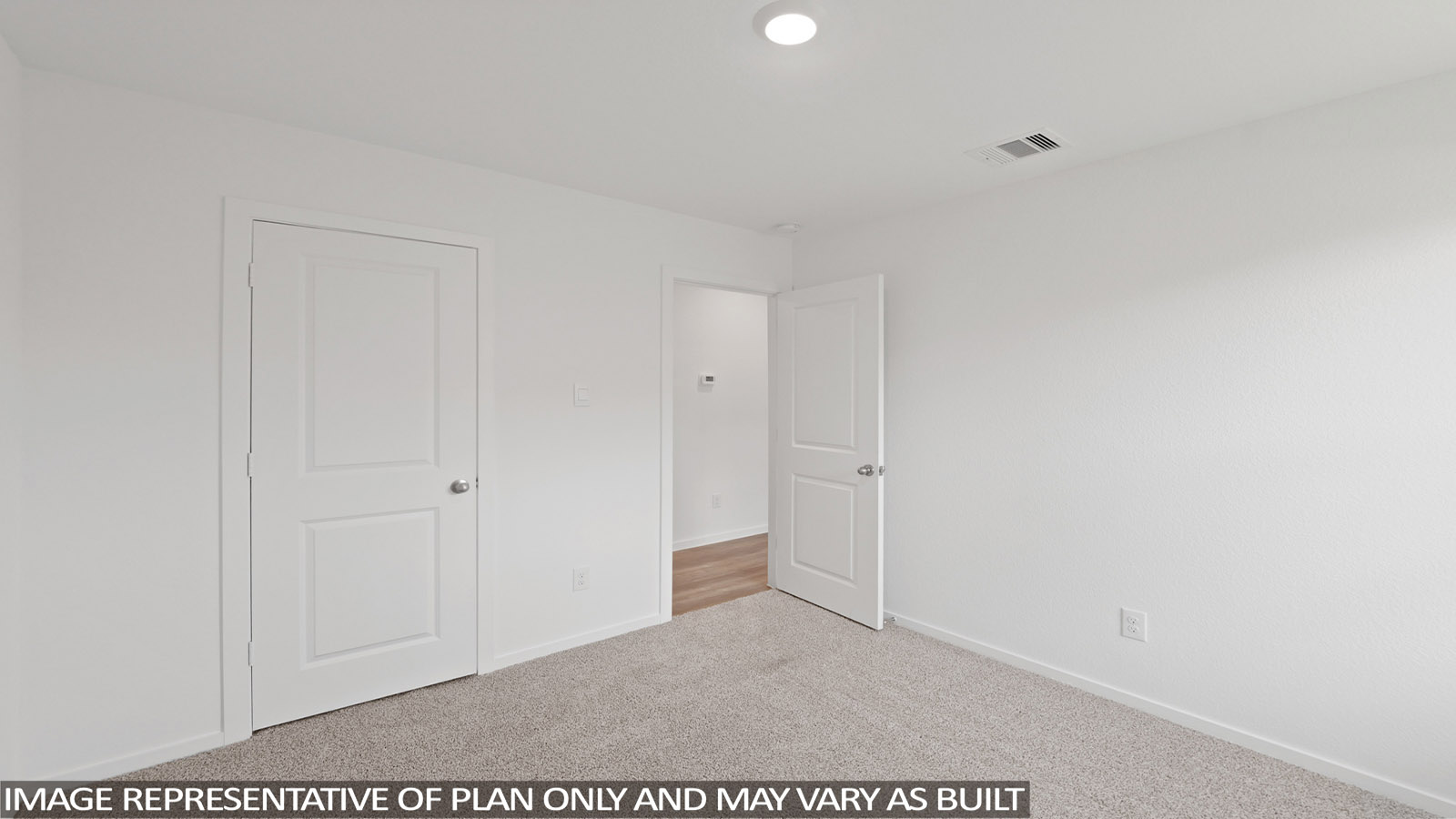 Secodnary bedroom with windows, white walls, and vinyl wood flooring.
