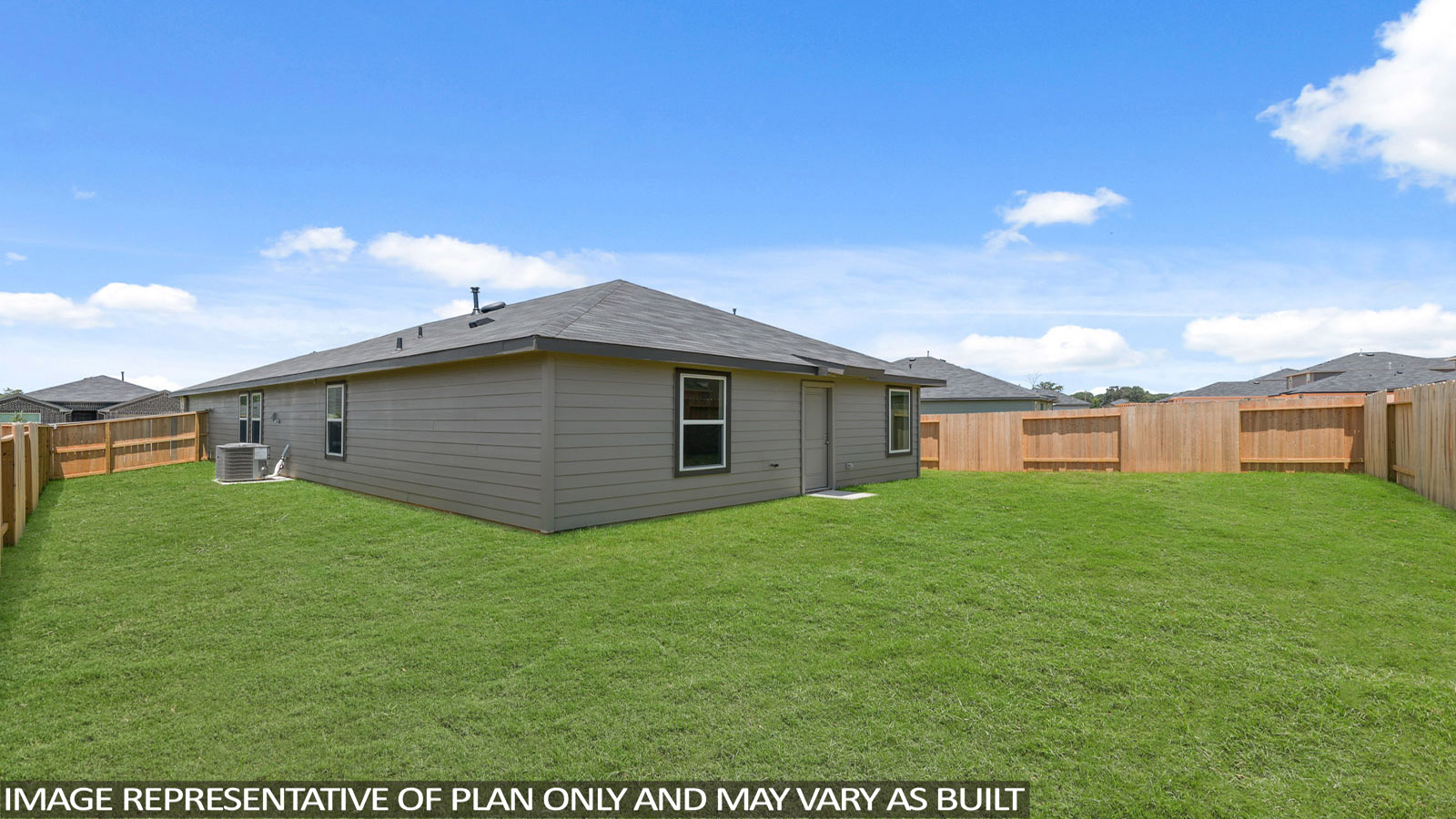 Landscaped backyard with a covered patio.