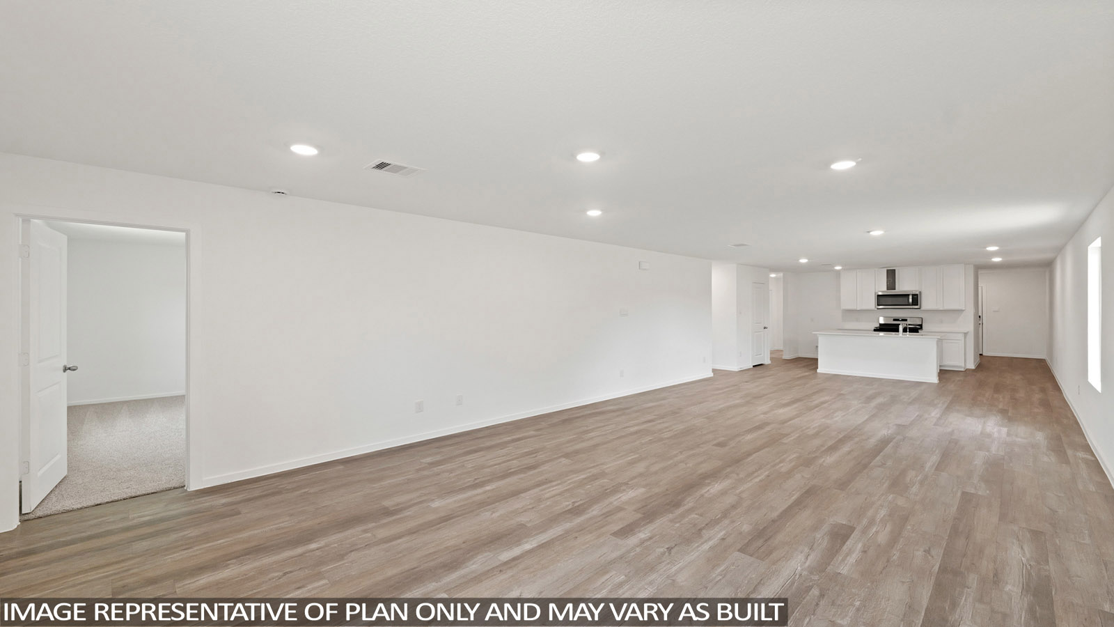 Open living room with windows, white walls, and vinyl wood flooring.