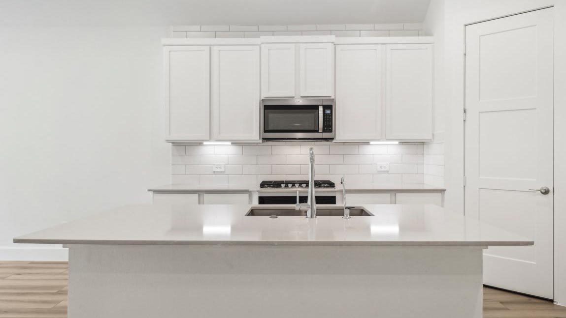 kitchen with stainless steel appliances and quartz countertops