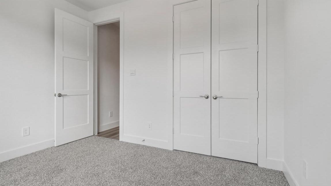 bedroom with carpet flooring and windows
