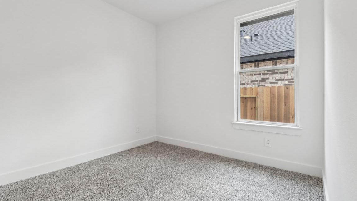 bedroom with carpet flooring and windows