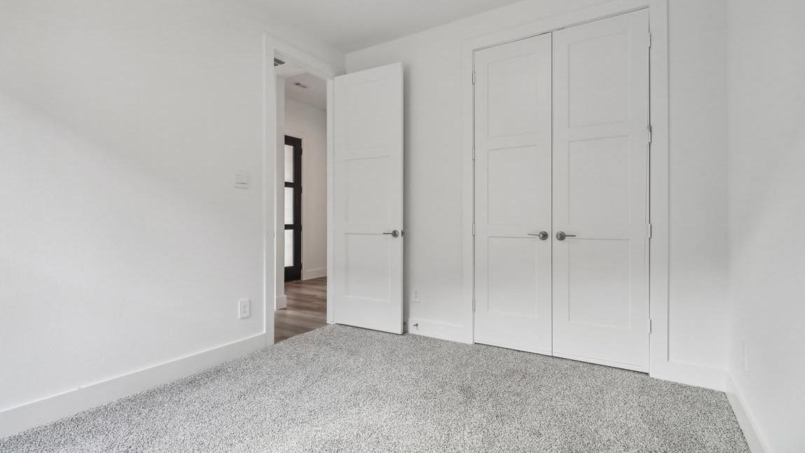 bedroom with carpet flooring and windows