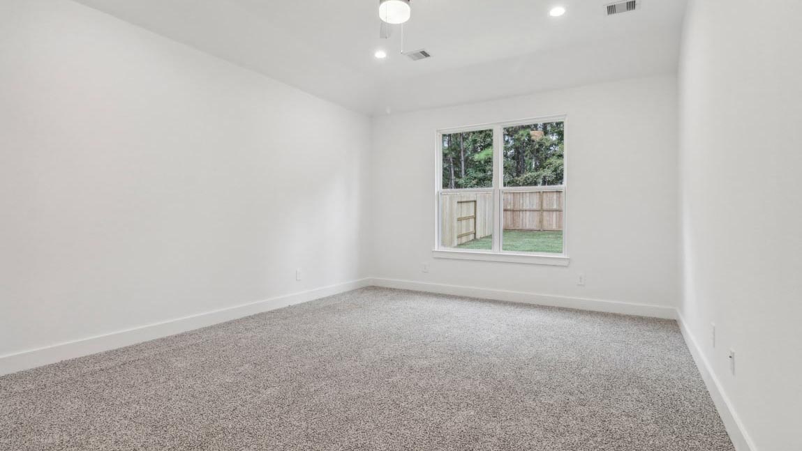 bedroom with carpet flooring and windows
