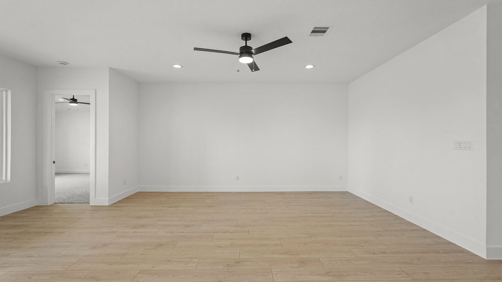 Dining area with vinyl flooring located off from the living room area in Magnolia TX