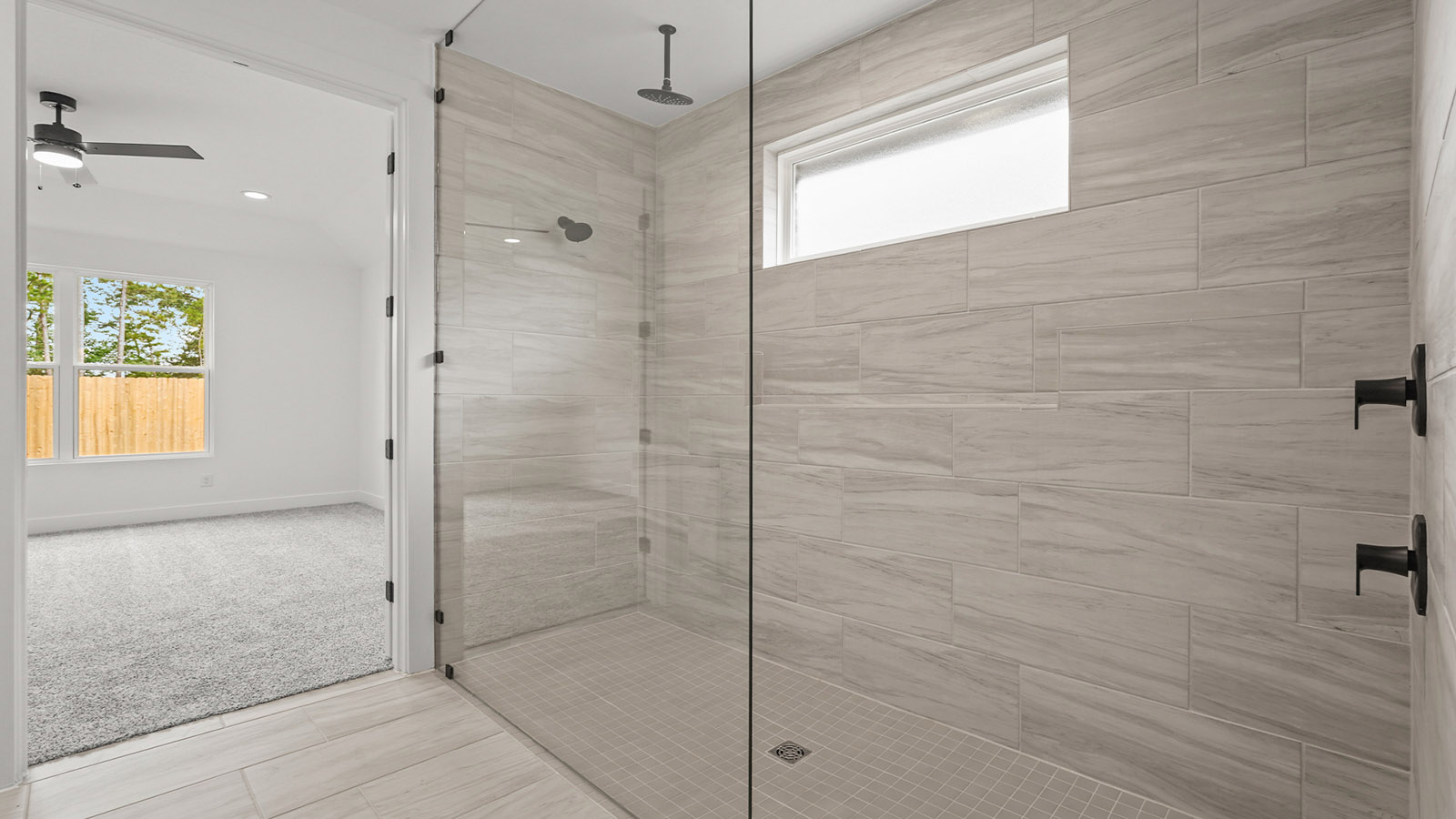 Primary bathroom with super shower with semi frameless glass in Magnolia TX