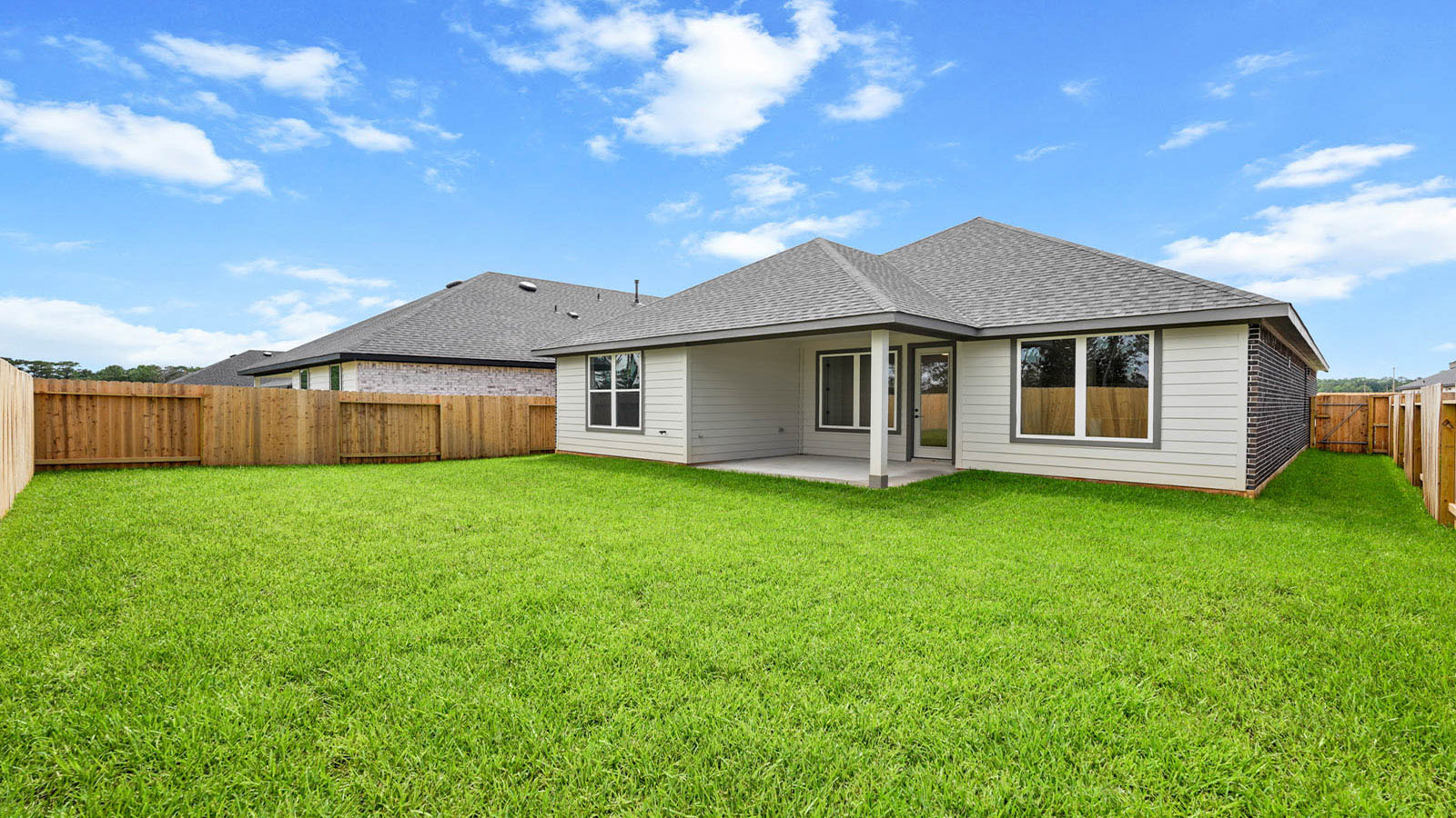 covered patio with jamies hardie siding and overhead lighting