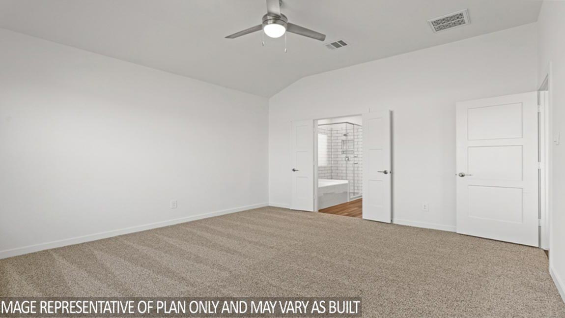 Secondary bedroom with shag carpet flooring and bright window