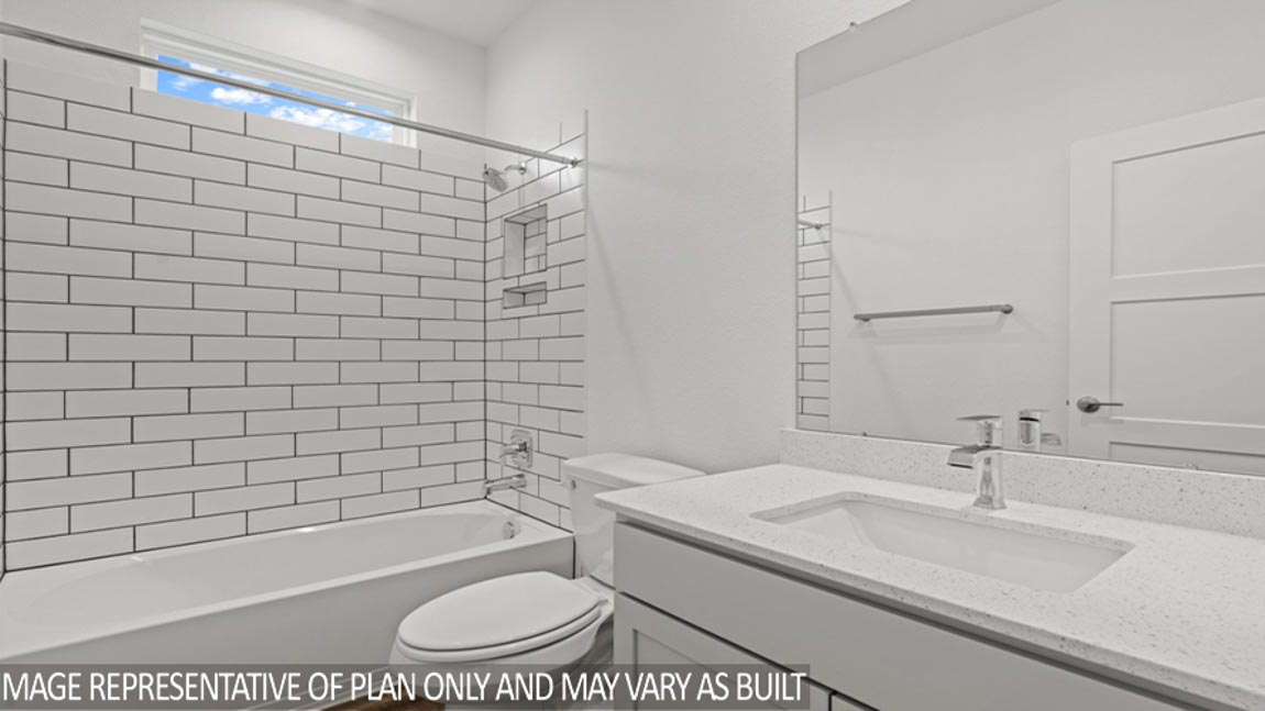 Secondary bathroom with tub/shower combo with quartz counter tops in Magnolia TX