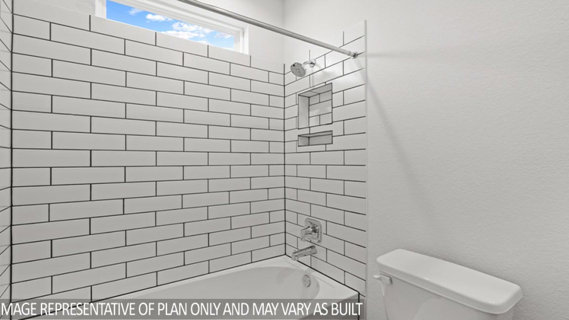 Secondary bathroom with tub/shower combo with quartz counter tops in Magnolia TX