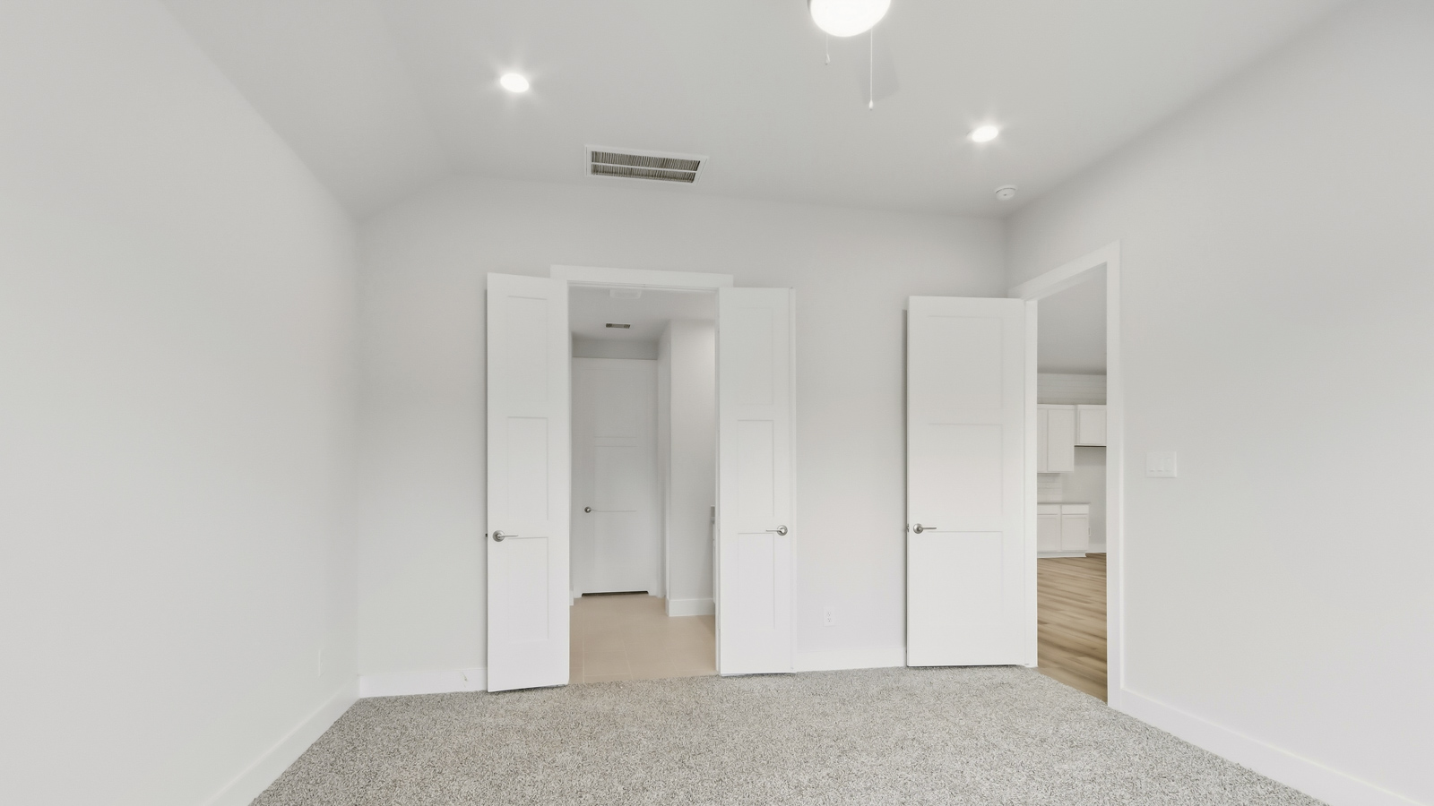 Secondary bedroom with shag carpet flooring and bright window