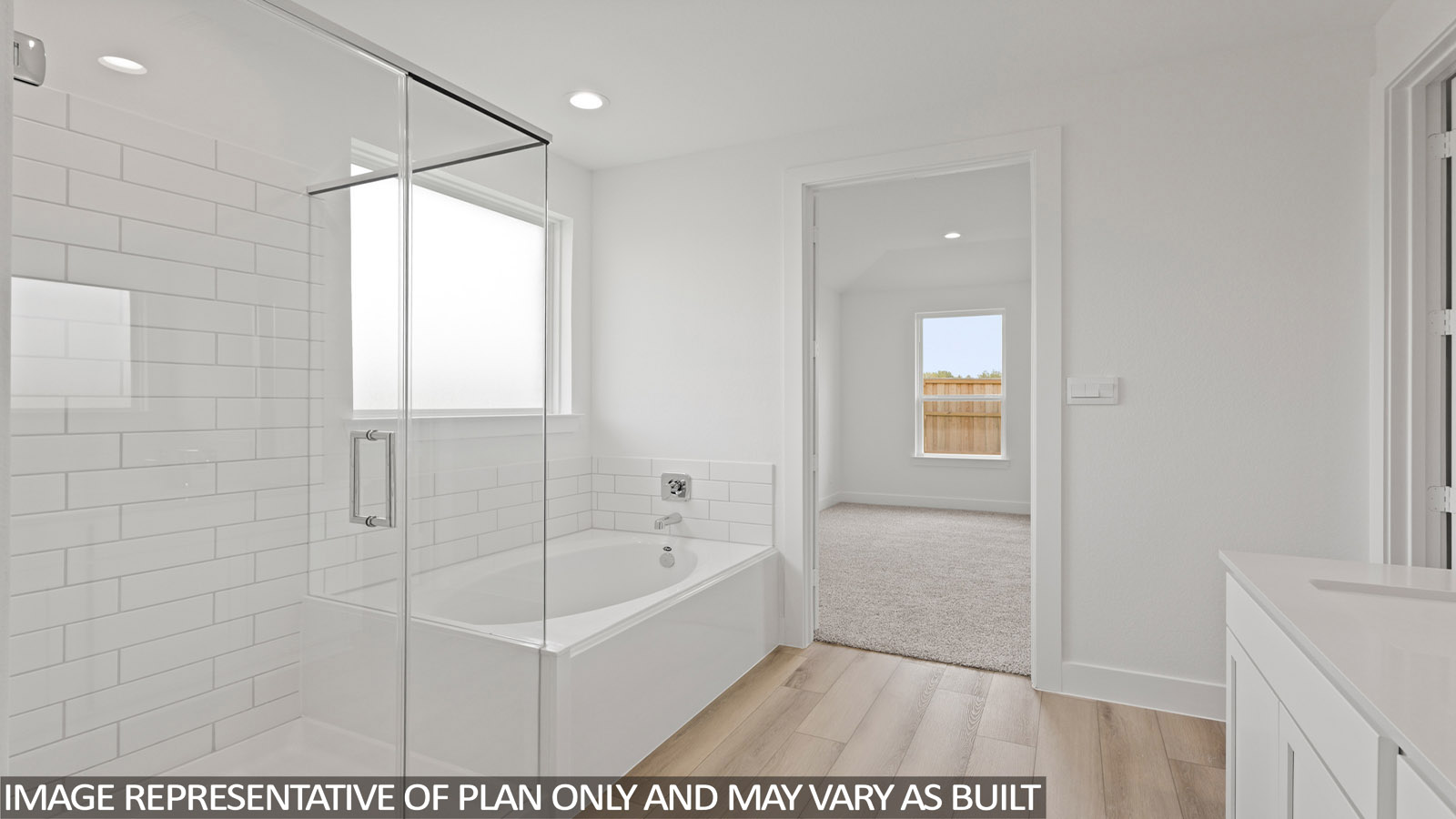 Primary bathroom with tub and shower