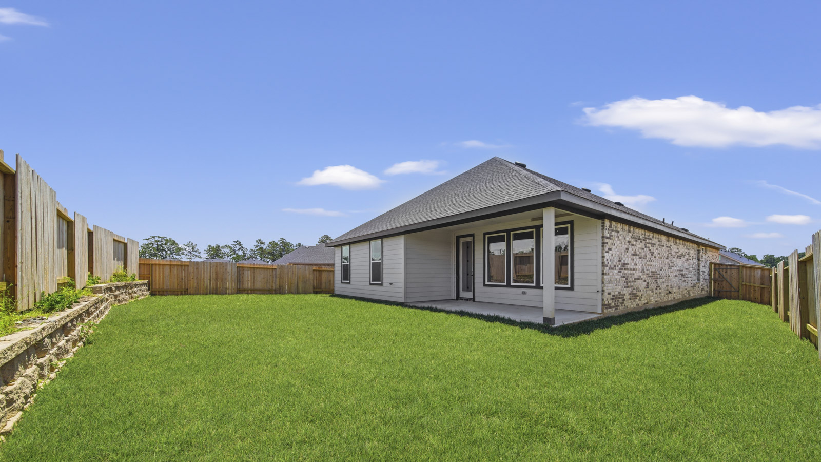 covered patio with jamies hardie siding and overhead lighting