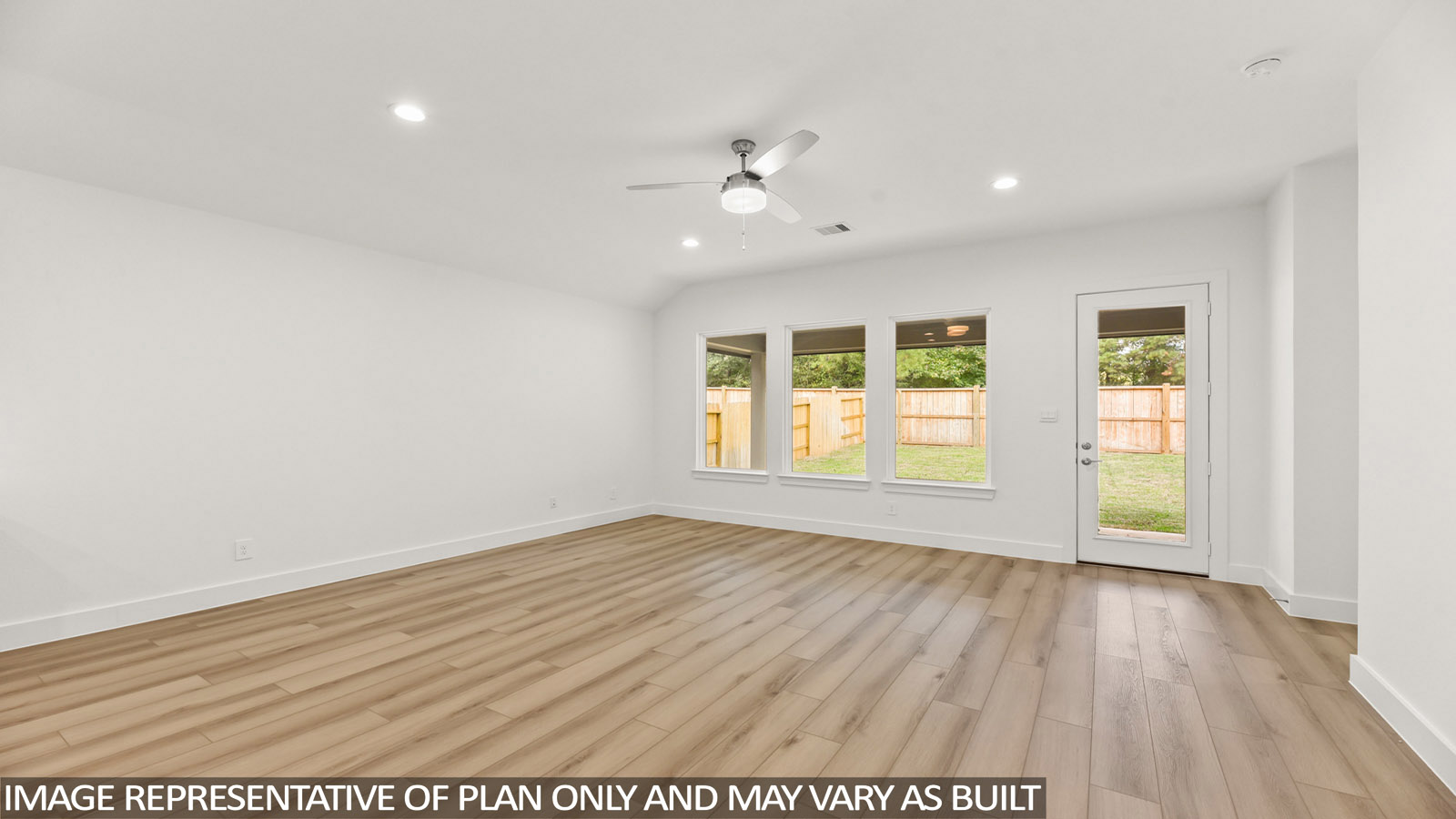 open concept living area with vinyl flooring and large windows
