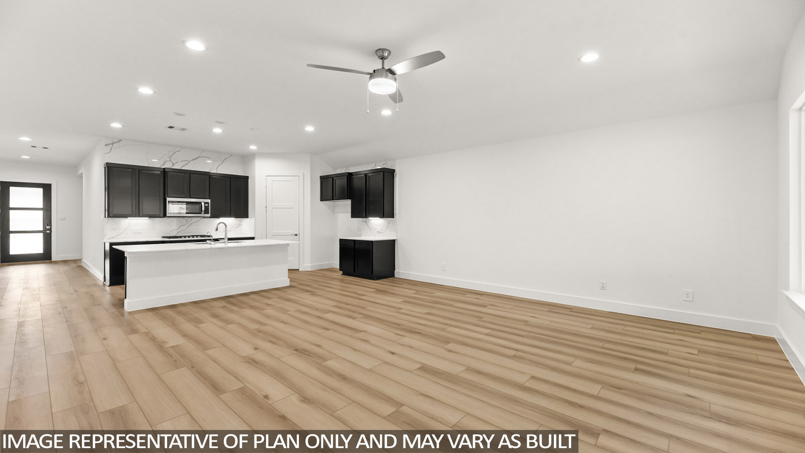 open concept living area with vinyl flooring and large windows