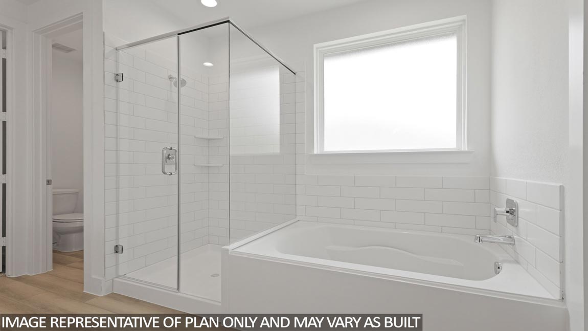 Primary bathroom with tub and shower