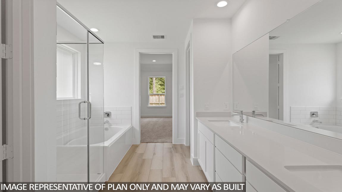 Primary bathroom with tub and shower