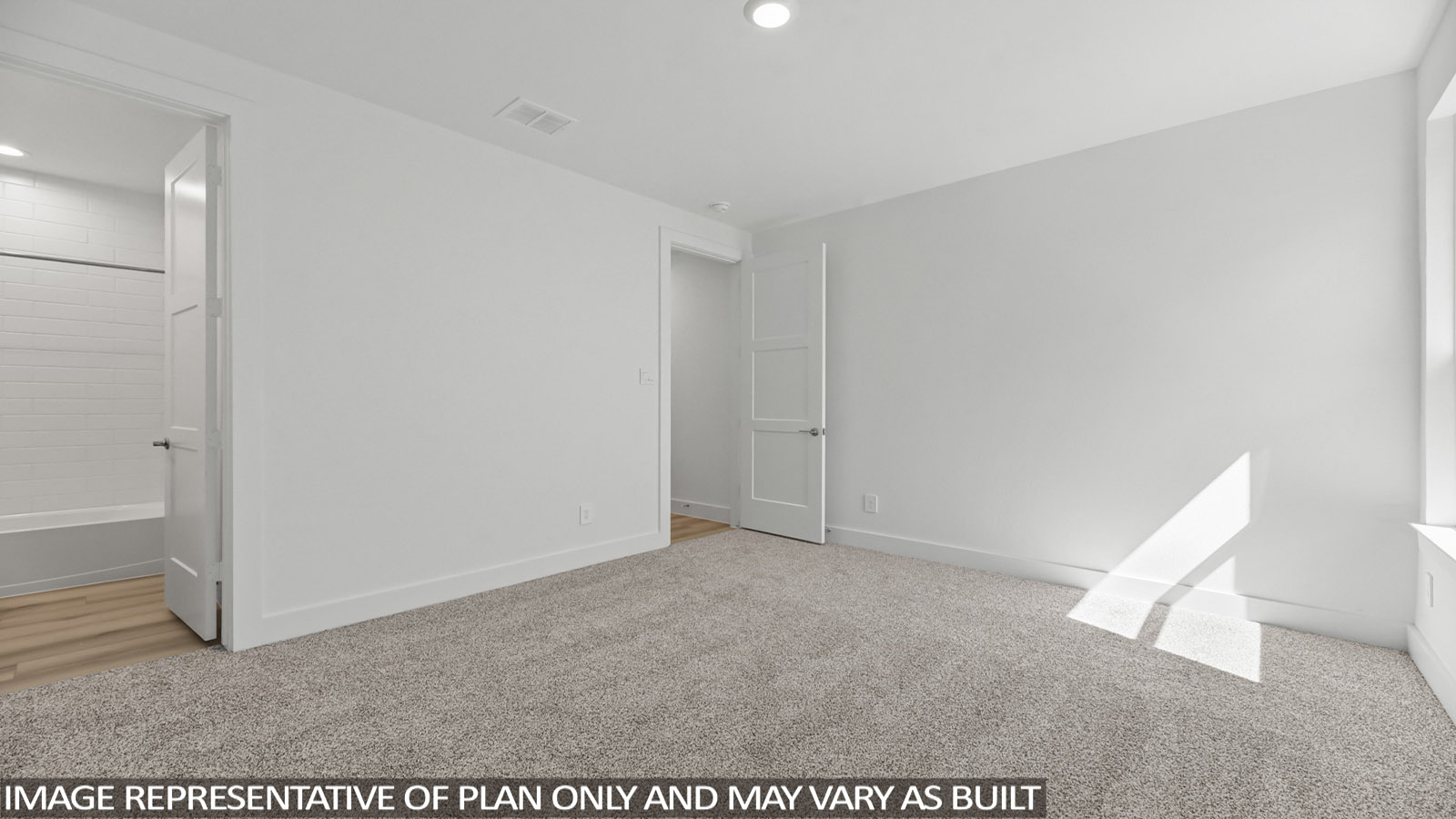 bedroom with carpet flooring and windows