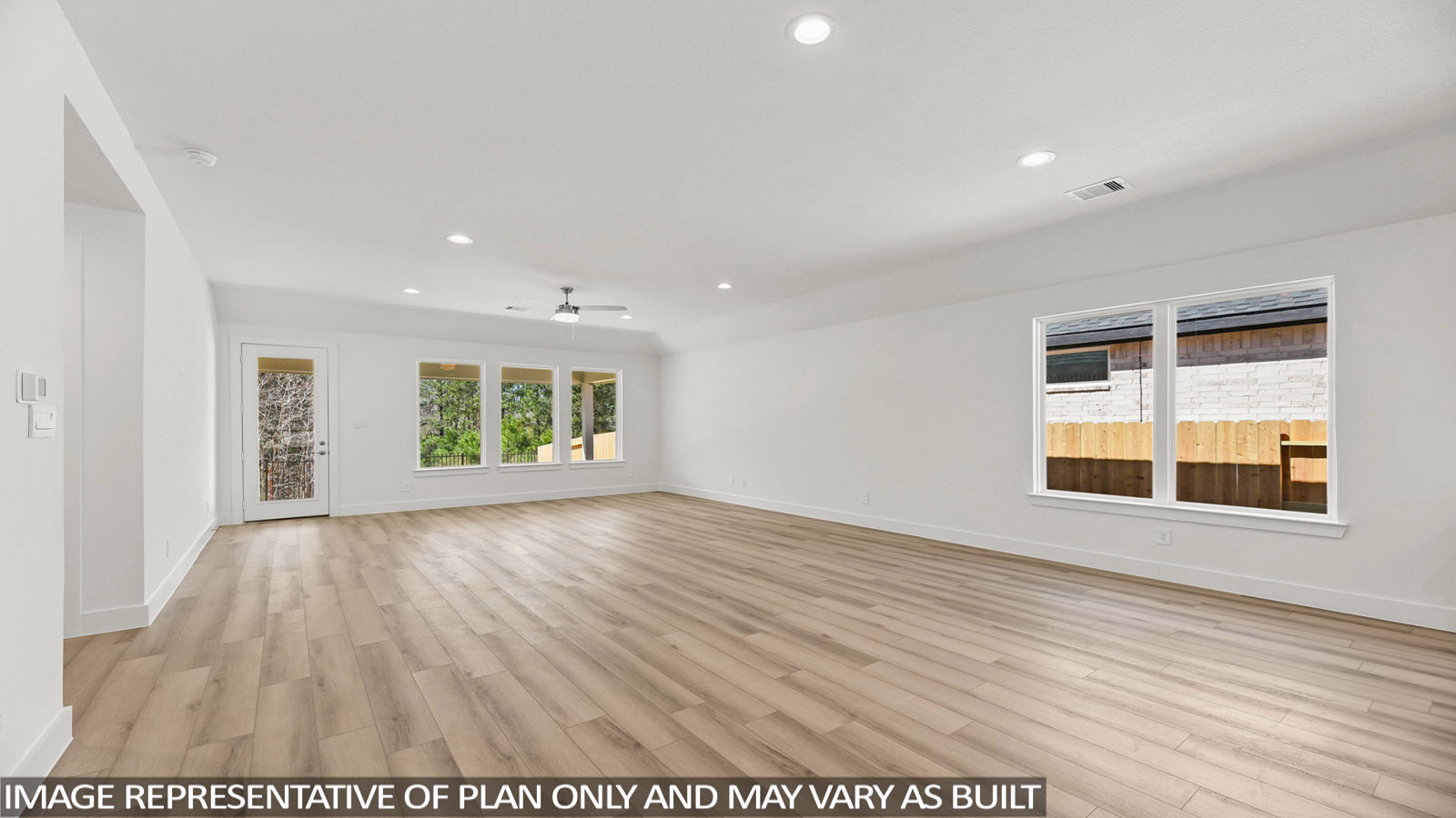 open concept living and dining area with vinyl flooring and large windows