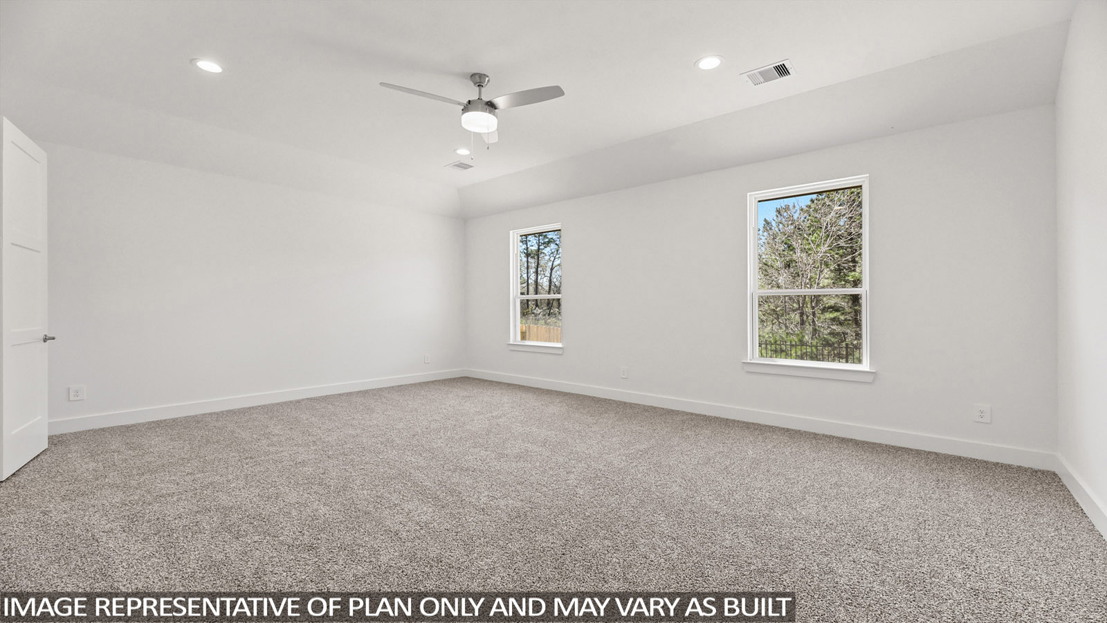 bedroom with carpet flooring and windows