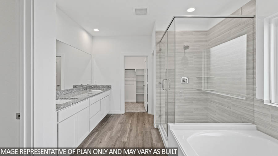 Primary bathroom with tub and shower