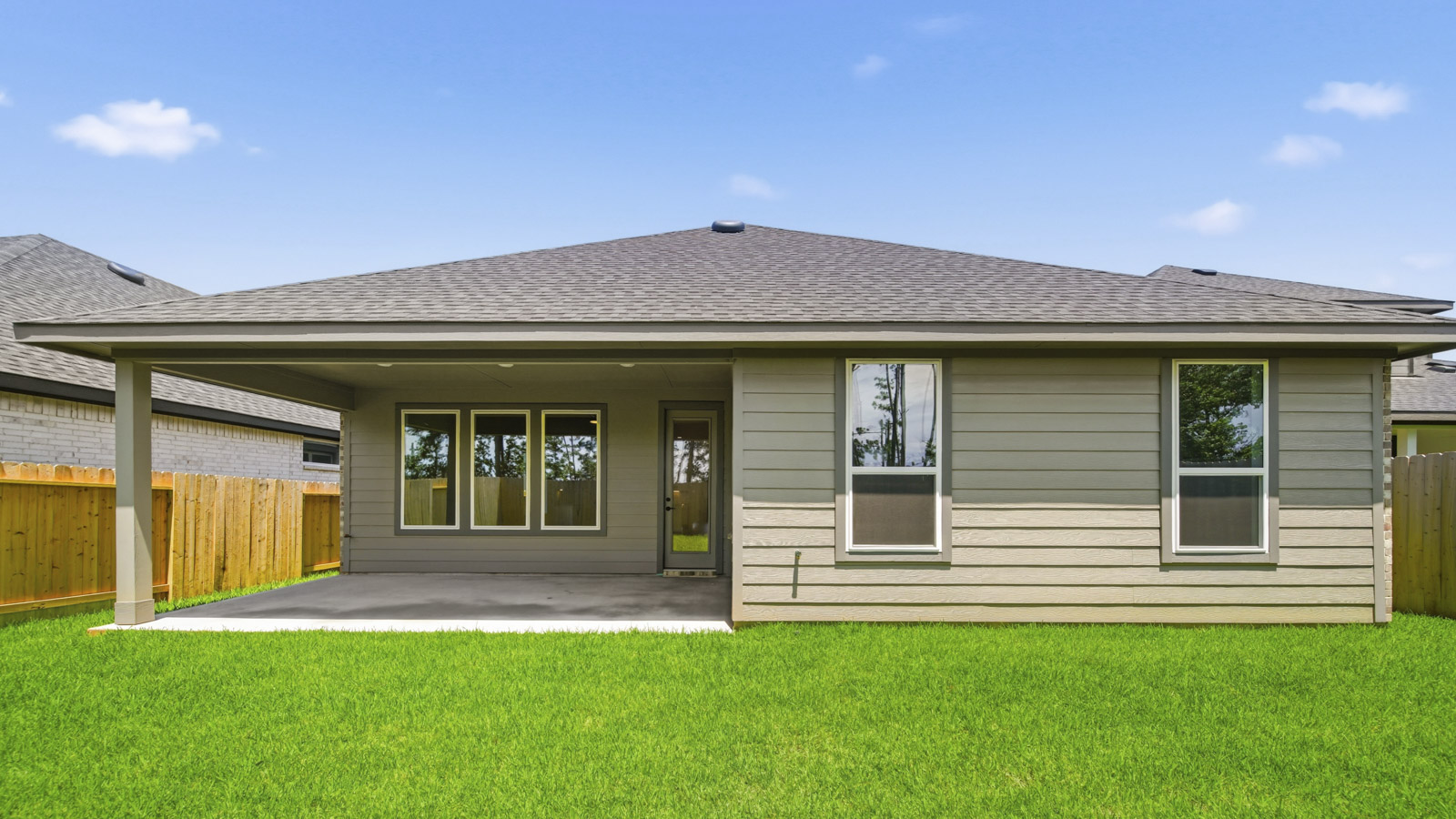 covered patio with jamies hardie siding and overhead lighting