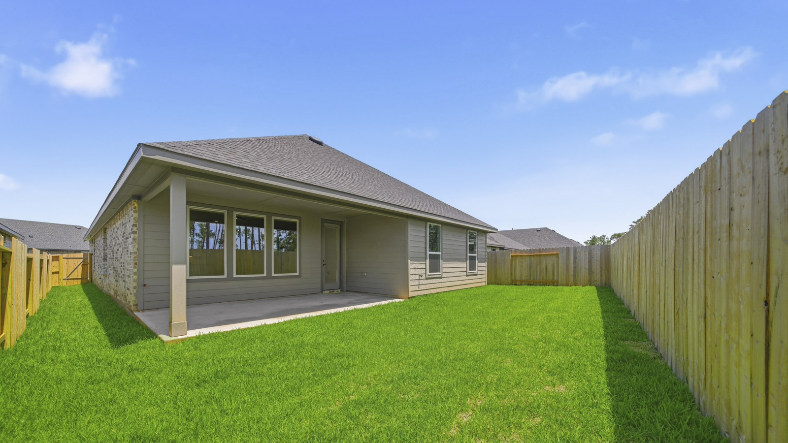 covered patio with jamies hardie siding and overhead lighting