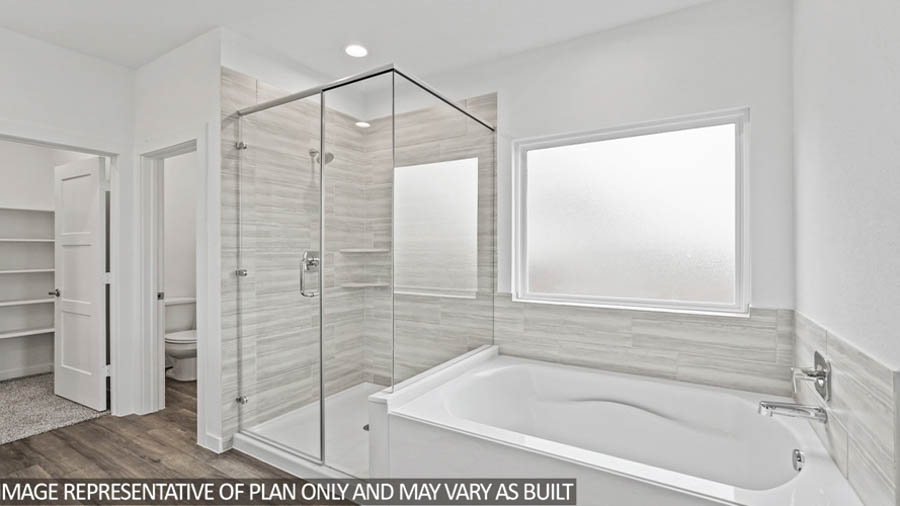 Primary bathroom with tub and shower