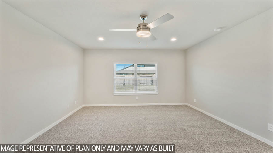 Primary bedroom with carpet flooring