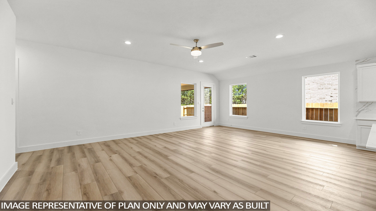 open concpt living and ding area with vinyl flooring and large windows