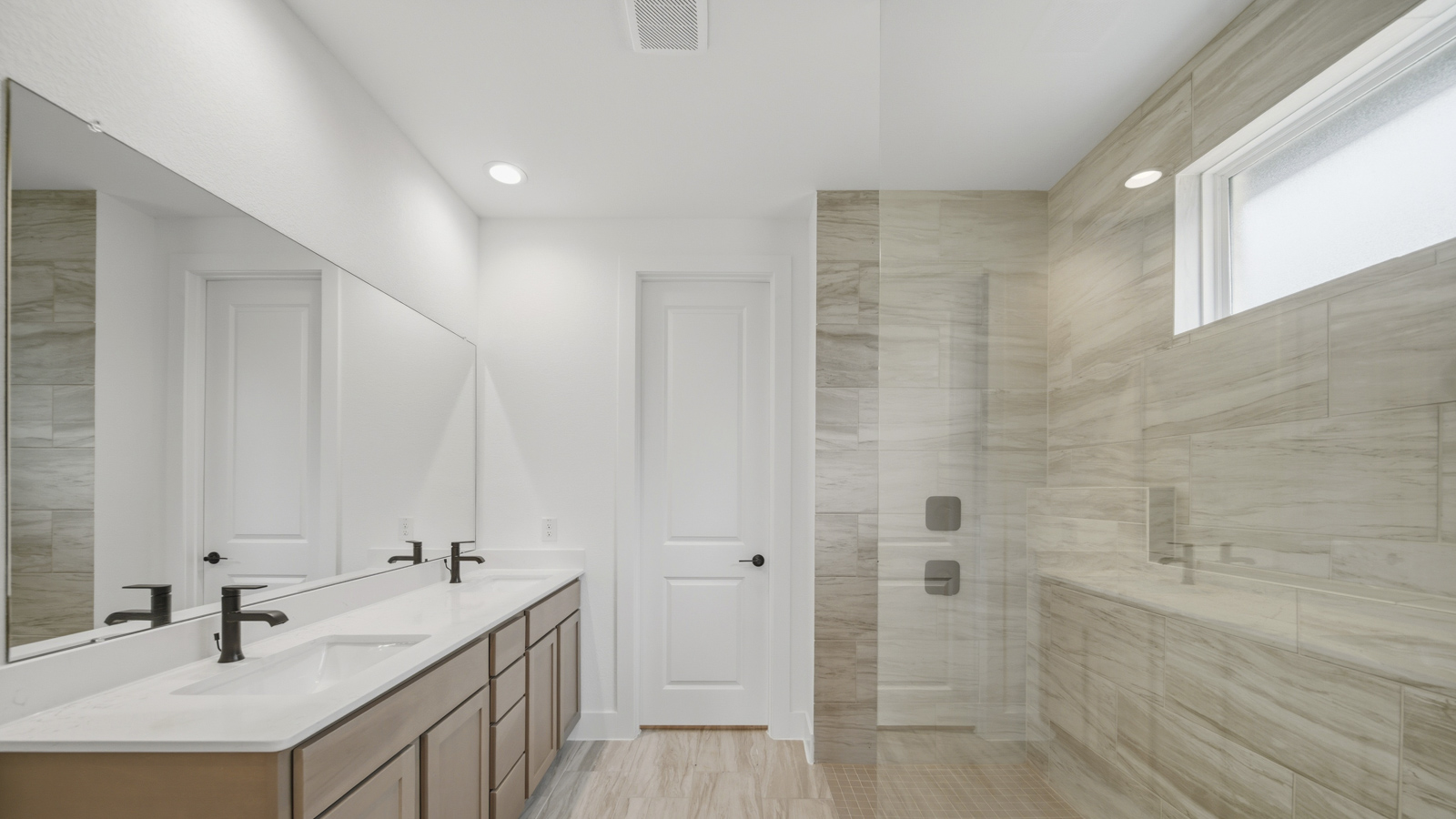 Primary bathroom with super shower with semi frameless glass in Magnolia TX