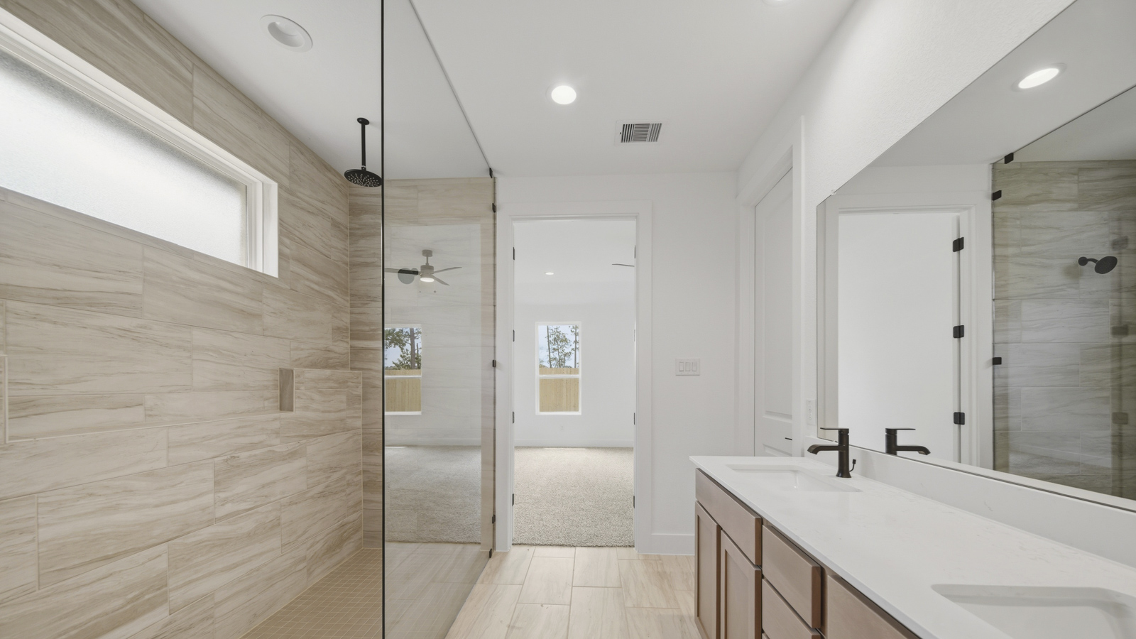 Primary bathroom with super shower with semi frameless glass in Magnolia TX