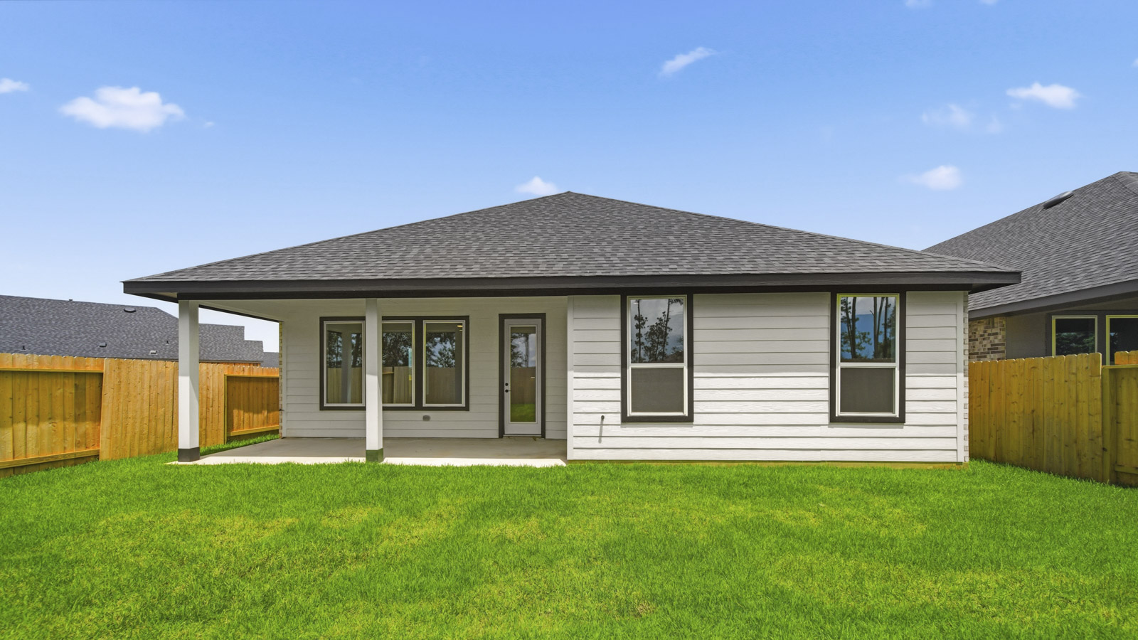 covered patio with jamies hardie siding and overhead lighting