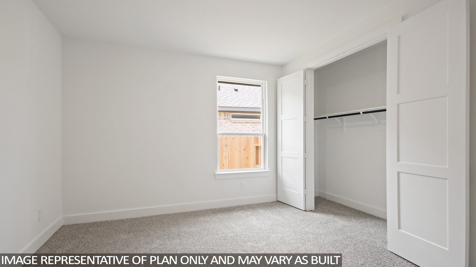 bedroom with windows and carpet