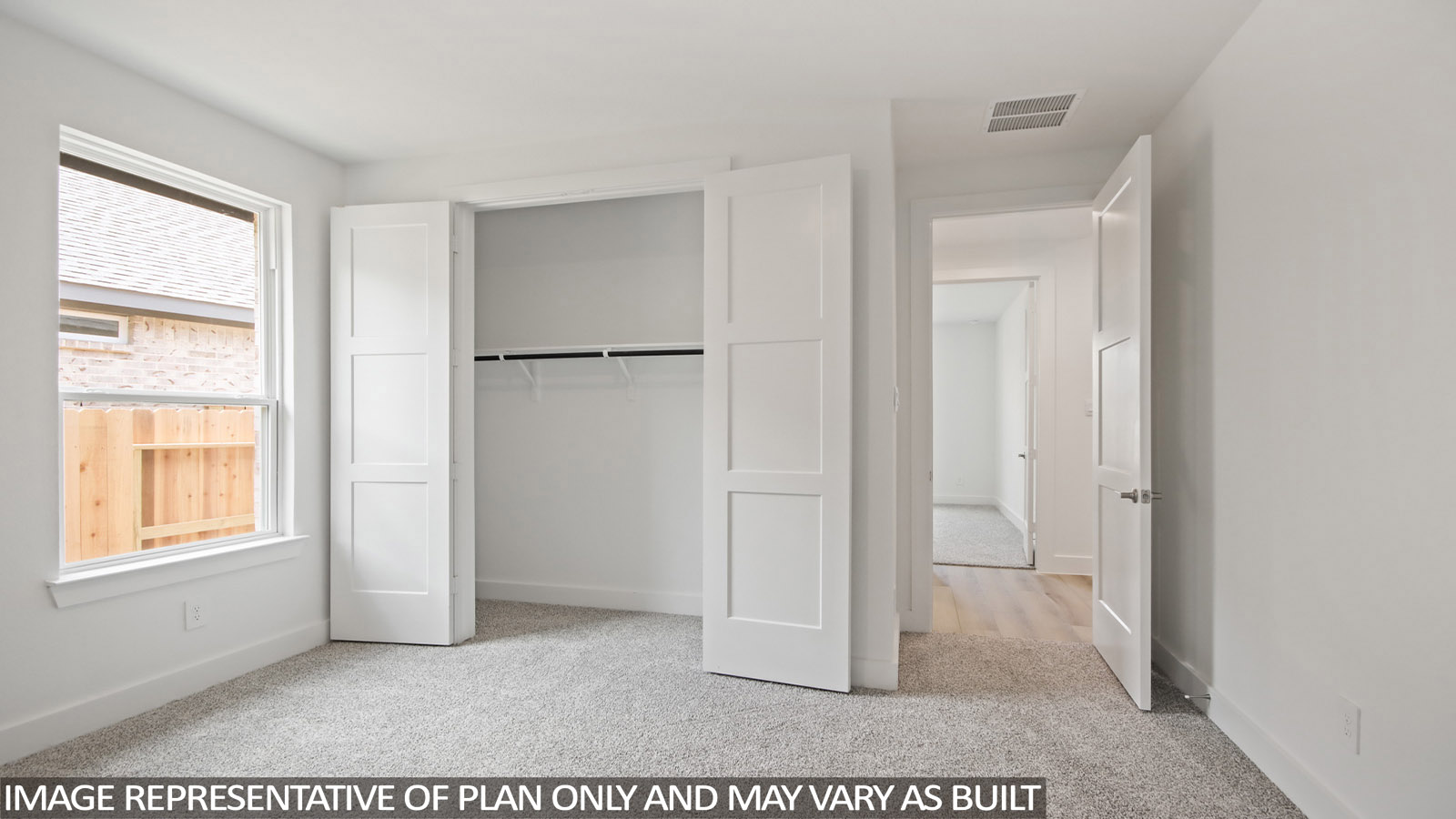 bedroom with windows and carpet