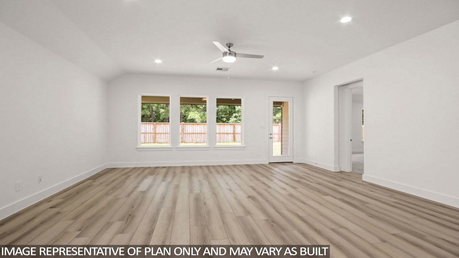 open concept living and dining with large windows