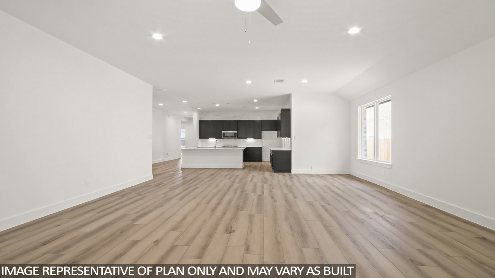 open concept living and dining with large windows