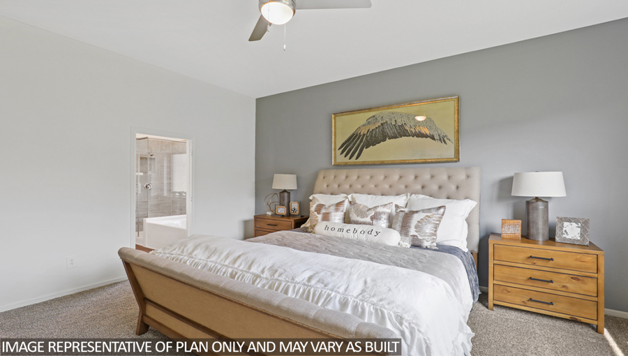 Primary bedroom with carpet flooring