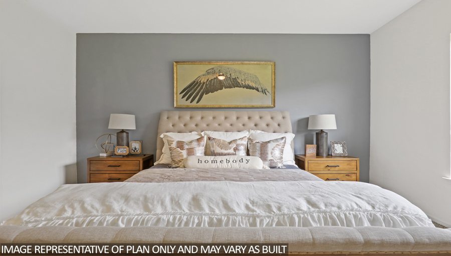 Primary bedroom with carpet flooring