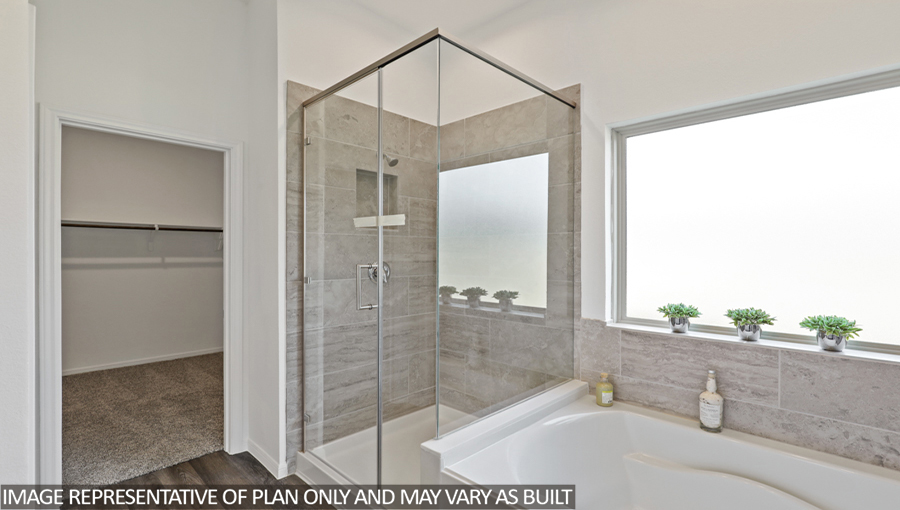 Primary bathroom with tub and shower